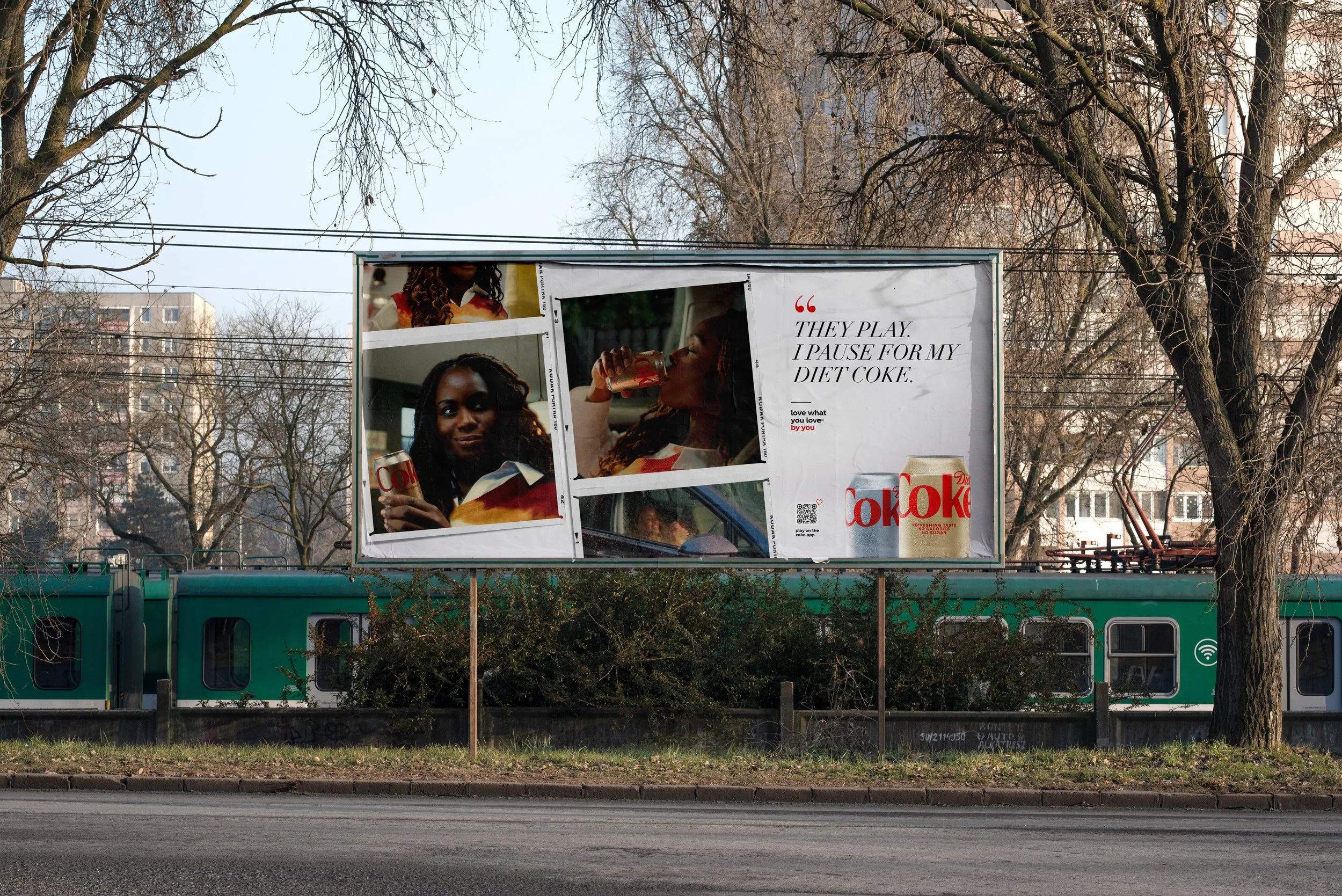 Trackside 48-sheet billboard showing a three-photo collage and the line They play. I pause for my Diet Coke.